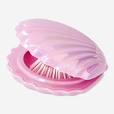Pink clamshell hairbrush and mirror set by Flying Tiger Copenhagen, featuring a compact personal care accessory for grooming.