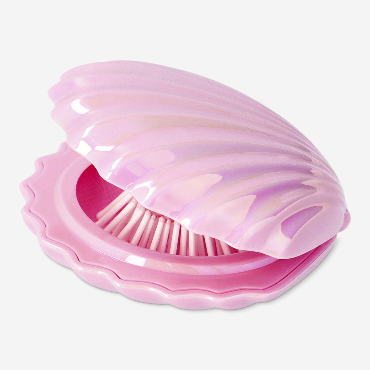 Pink clamshell hairbrush and mirror set by Flying Tiger Copenhagen, featuring a compact personal care accessory for grooming.