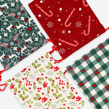 Four Flying Tiger Copenhagen Christmas print drawstring gift bags for office gift wrapping, featuring festive holiday designs.