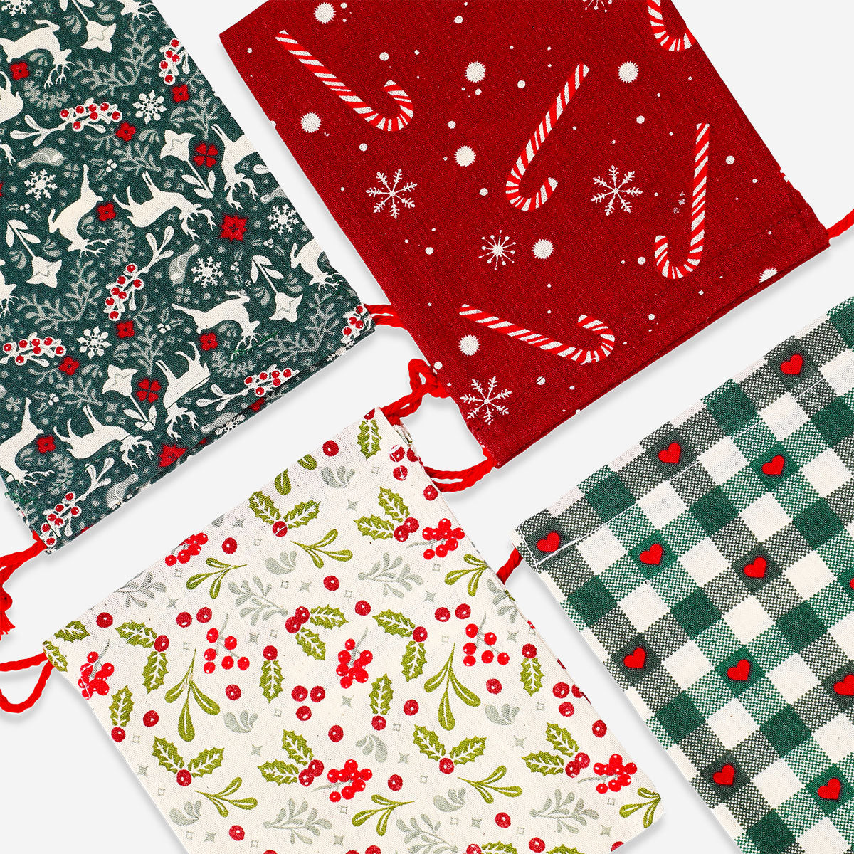 Four Flying Tiger Copenhagen Christmas print drawstring gift bags for office gift wrapping, featuring festive holiday designs.