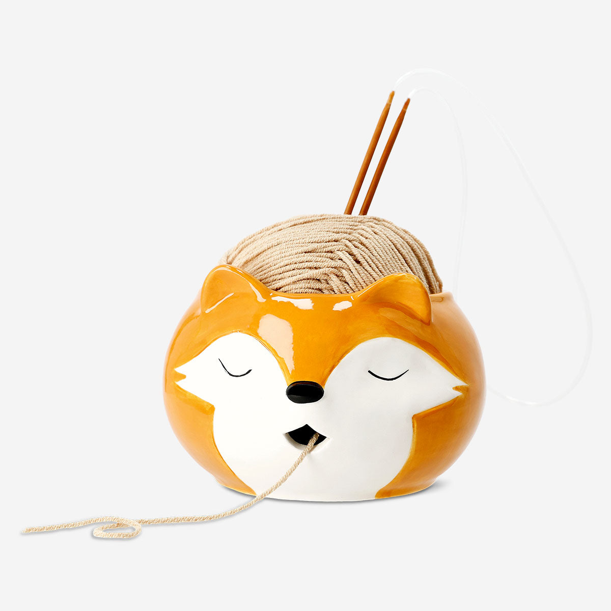 Flying Tiger Copenhagen knitting set with ceramic yarn bowl, ideal for hobby knitters with colorful yarn and knitting tools.