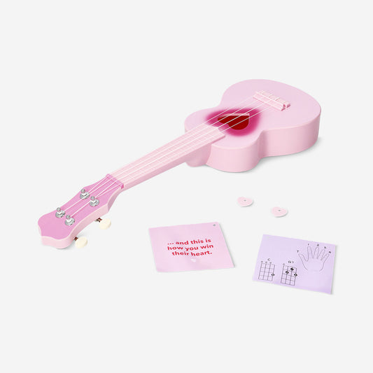 Pink ukulele with heart cut out