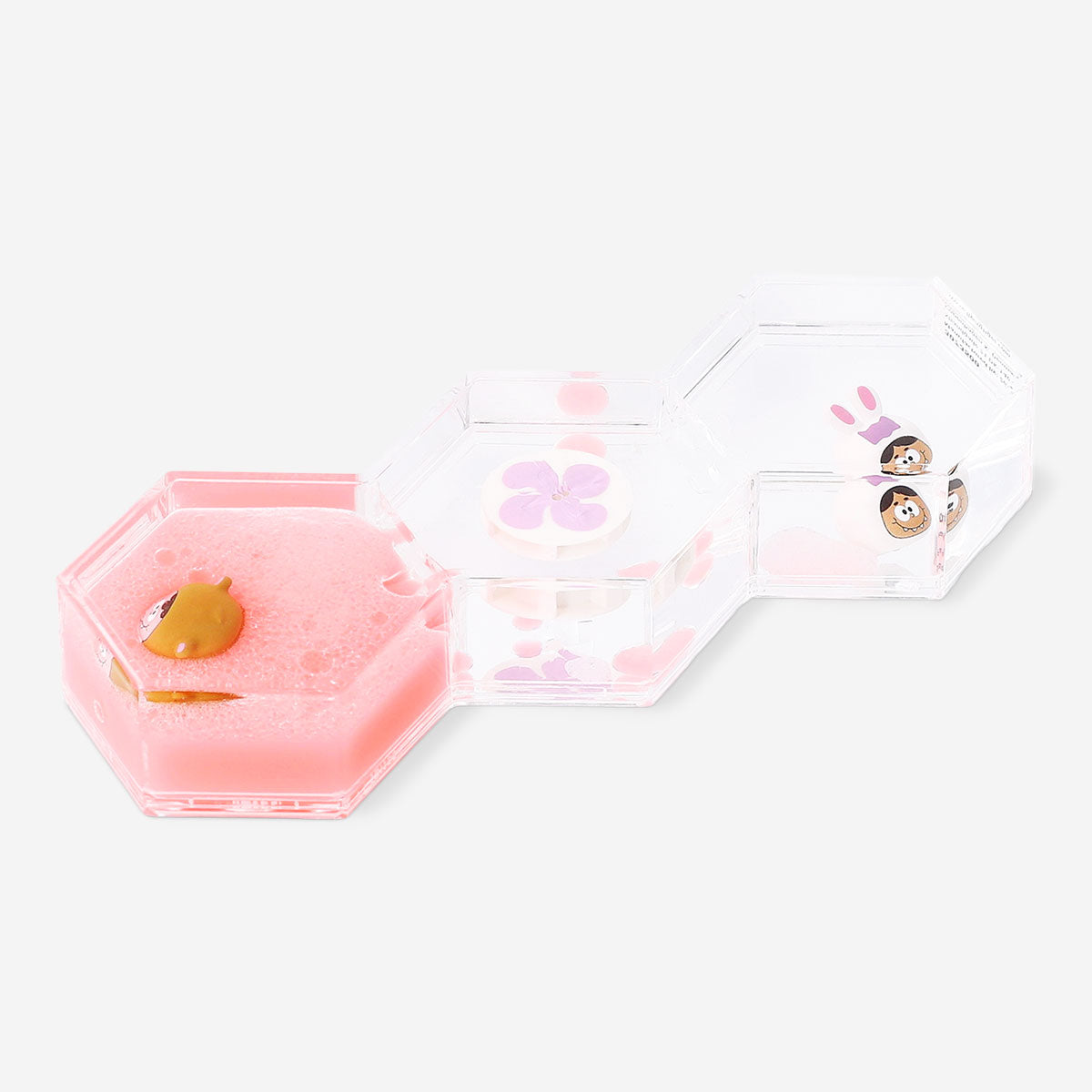 Decorative gadget hourglass by Flying Tiger Copenhagen featuring candy monster icon designs in clear glass.