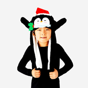 Penguin party hat with moving wings by Flying Tiger Copenhagen, featuring a cute penguin design and animated wing movement.