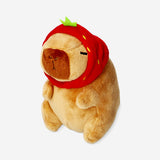 Plush toy capybara with strawberry hat