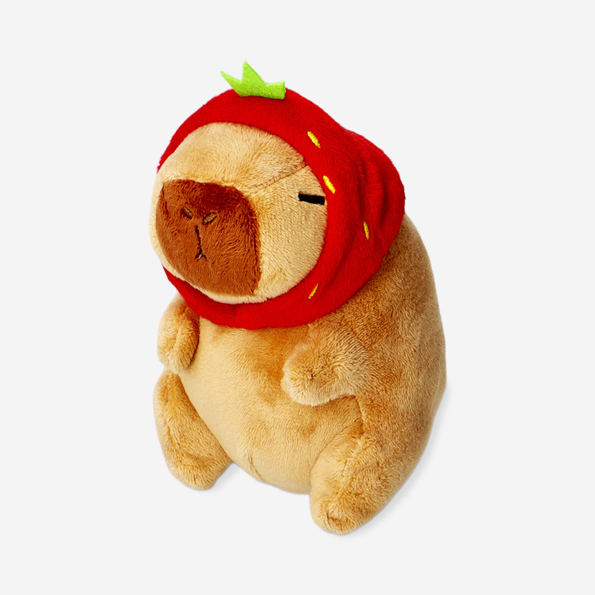 Plush toy capybara with strawberry hat