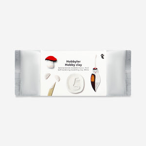 White air drying clay for hobbies by Flying Tiger Copenhagen, shown in a close-up image with a smooth, pliable texture.