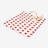 Flying Tiger Copenhagen heart print textile tote bag with sturdy handles and vibrant heart design on durable fabric.