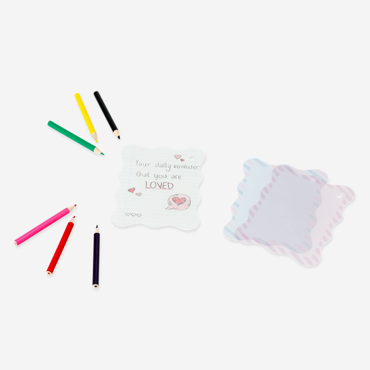 Colorful DIY keyrings made from shrink plastic, hobby craft project by Flying Tiger Copenhagen featuring vibrant, custom-designed accessories.