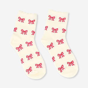 Pink textile socks with bow accents, size 36/38, by Flying Tiger Copenhagen, featuring a soft fabric and decorative bows.