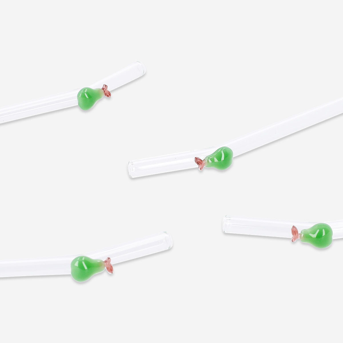 Set of four green glass straws with pear-shaped decorations, suitable for kitchen use, from Flying Tiger Copenhagen.
