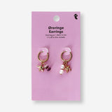 Textile hanging earrings featuring seastar charms and decorative details, designed by Flying Tiger Copenhagen.