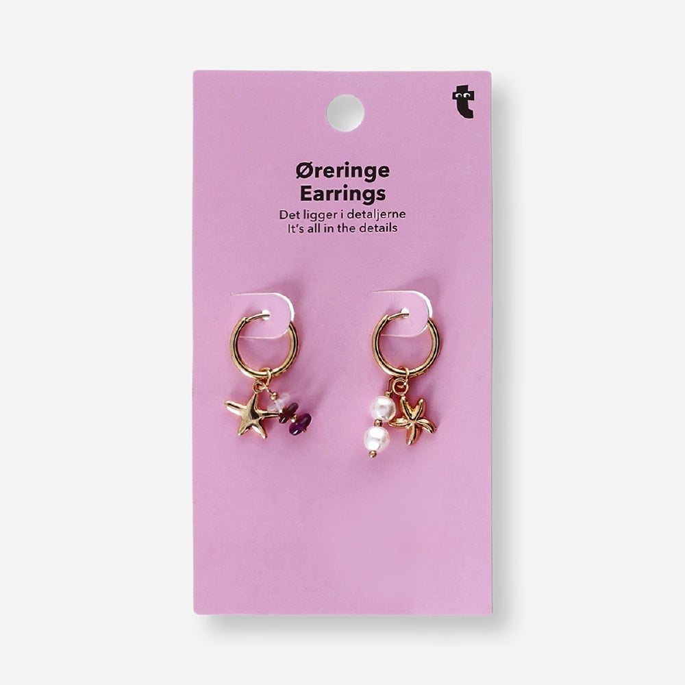 Textile hanging earrings featuring seastar charms and decorative details, designed by Flying Tiger Copenhagen.