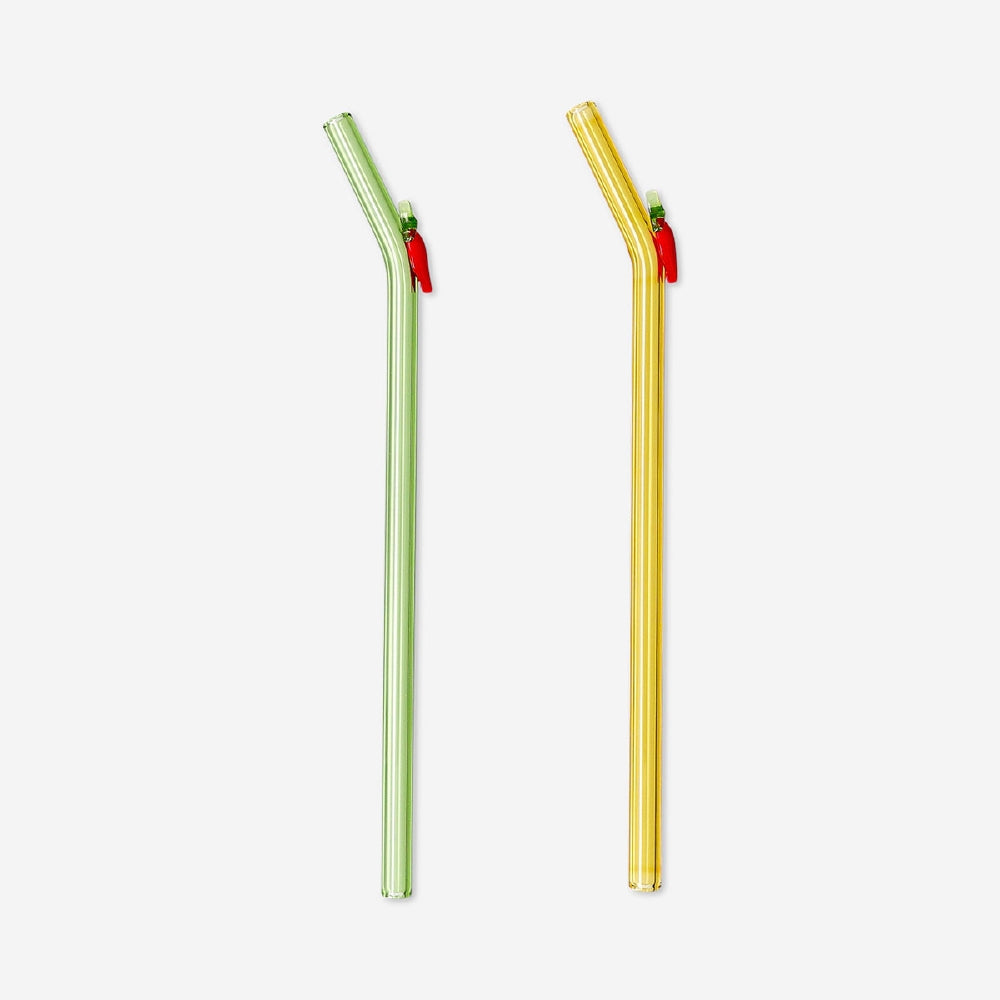 Two glass straws with chilli-shaped decorations from Flying Tiger Copenhagen, perfect for adding a spicy touch to drinks.