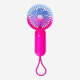 Gradient pink handheld fan with strap, Flying Tiger Copenhagen gadget, compact portable fan for personal cooling.