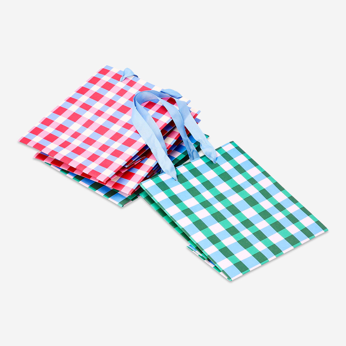 Four checkered gift bags for office use by Flying Tiger Copenhagen, featuring stylish plaid patterns.
