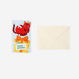 Office birthday card featuring a cat illustration holding a present, by Flying Tiger Copenhagen.