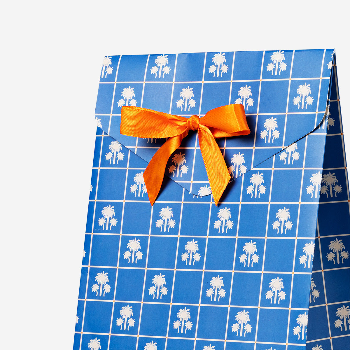 Blue Flying Tiger Copenhagen office gift box with ribbon, featuring a neatly wrapped presentation and decorative bow on top.