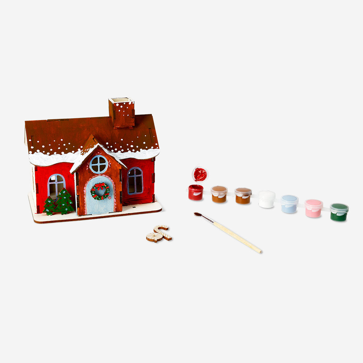 DIY wooden gingerbread house hobby kit by Flying Tiger Copenhagen, featuring assembled wooden pieces for creative holiday decoration.