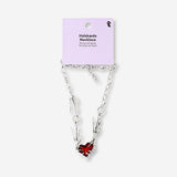 Silver textile necklace featuring a red heart pendant, stylish jewelry accessory by Flying Tiger Copenhagen.