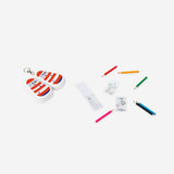 Mini coloured pencils set with a colouring book by Flying Tiger Copenhagen, featuring vibrant pencils and a fun, illustrated colouring page.