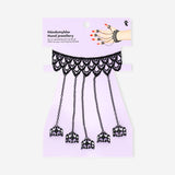 Colorful hand lace textile jewelry by Flying Tiger Copenhagen featuring intricate lacework and delicate craftsmanship.