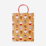 Office gift bag featuring cute Christmas characters from Flying Tiger Copenhagen, with festive holiday-themed illustrations.