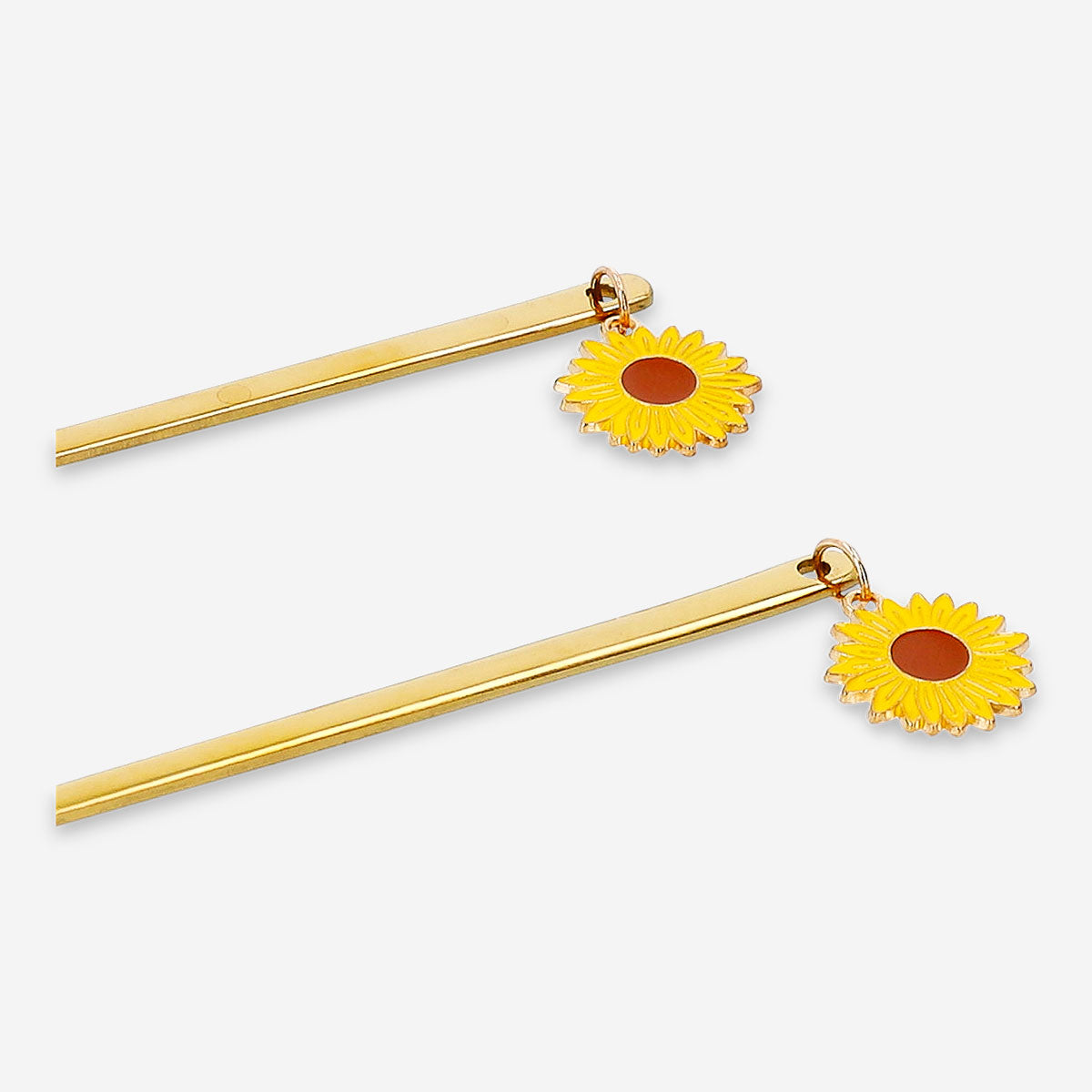 Set of two gold dessert spoons with sunflower toppers, perfect for elegant serving from Flying Tiger Copenhagen.