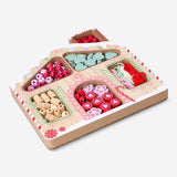 Colorful bead set with string featuring a Christmas house design, perfect for hobby crafts by Flying Tiger Copenhagen.