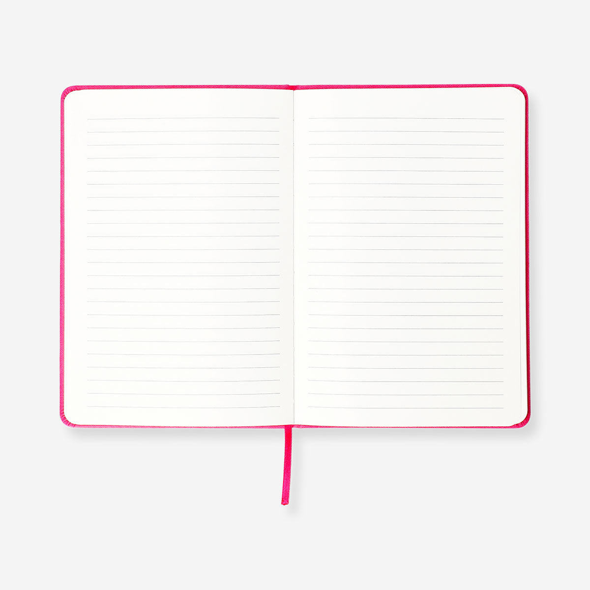 Pink A5 office notebook with pom poms from Flying Tiger Copenhagen, featuring a soft cover and decorative pom pom accents.