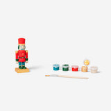 DIY wooden nutcracker hobby craft by Flying Tiger Copenhagen, showing a hand-painted nutcracker figure made of wood.