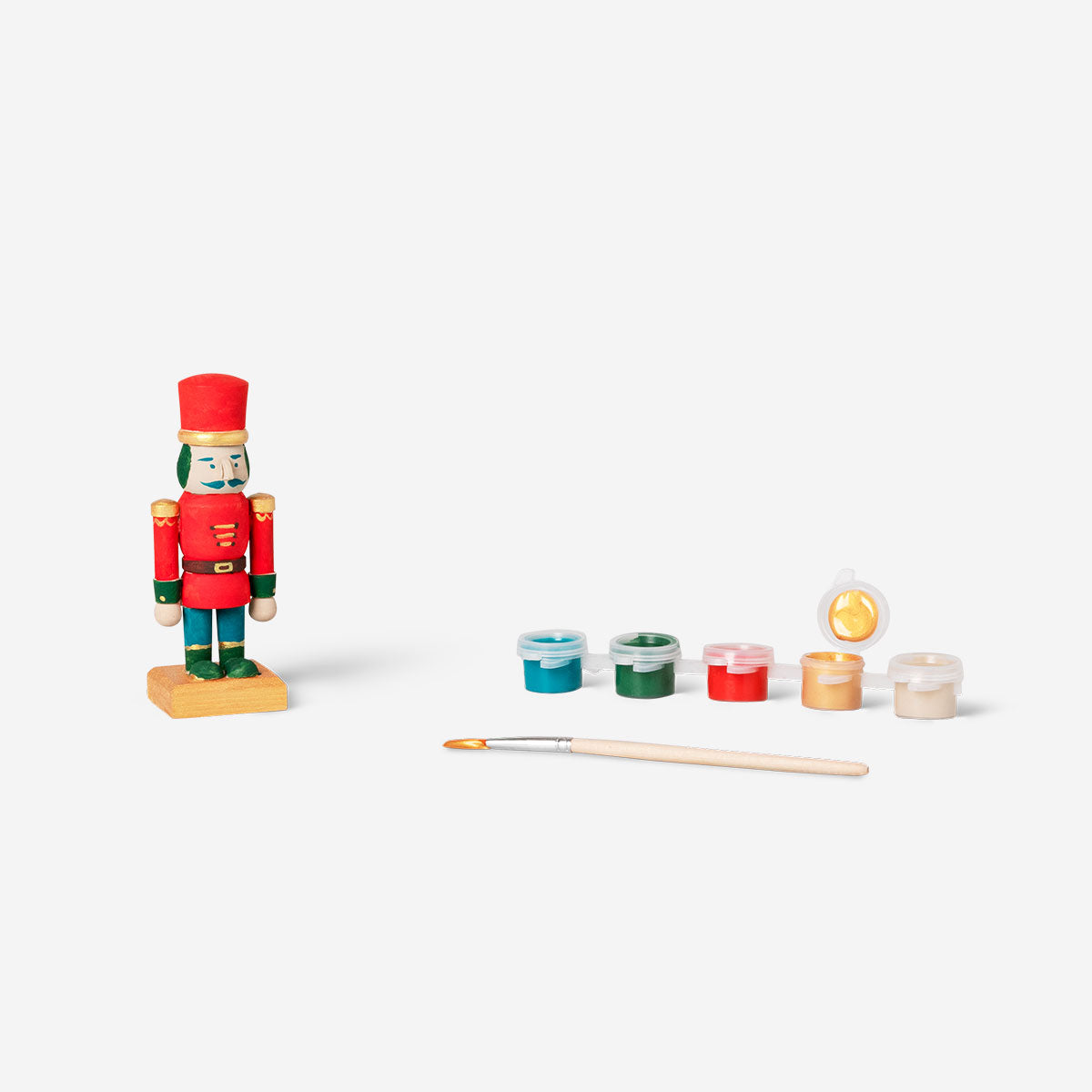 DIY wooden nutcracker hobby craft by Flying Tiger Copenhagen, showing a hand-painted nutcracker figure made of wood.