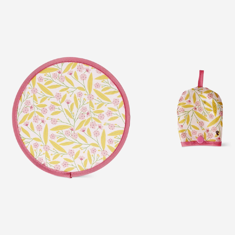 Foldable textile fan with colorful flower print from Flying Tiger Copenhagen, showcasing its compact, portable design.