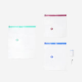 Flying Tiger Copenhagen vacuum pump with 7 clothing vacuum bags, ideal for space-saving storage and travel organization.
