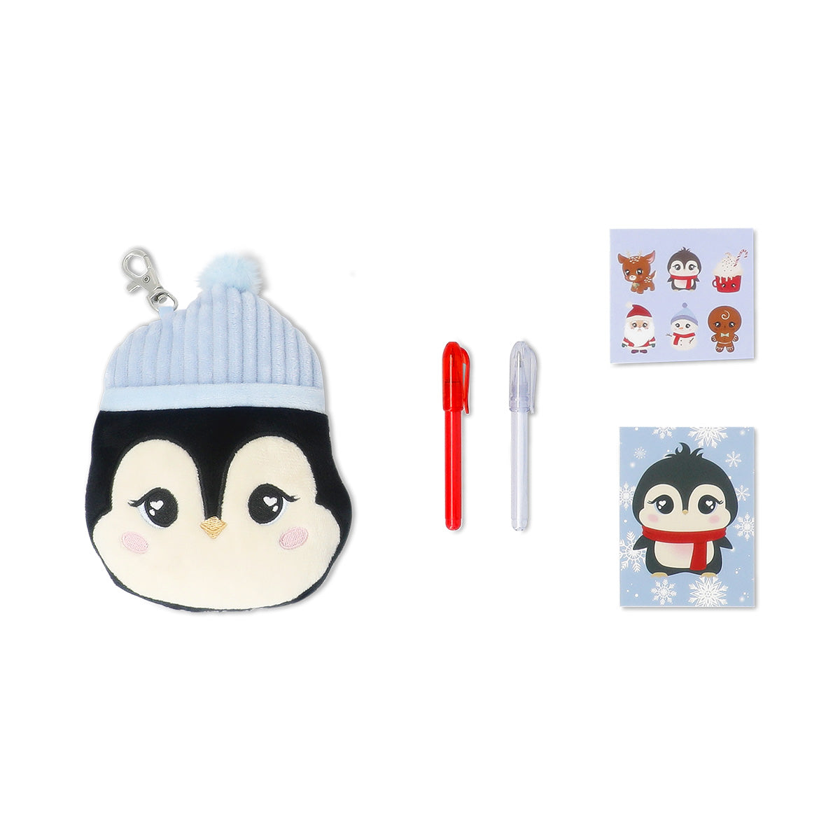 Office stationery kit featuring a plush penguin from Flying Tiger Copenhagen with pens, pencils, and stationery accessories.