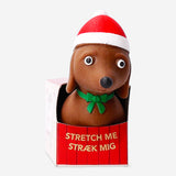 Flying Tiger Copenhagen Christmas sausage dog gadget, press me toy with festive holiday design, soft and squeezable for fun interaction.