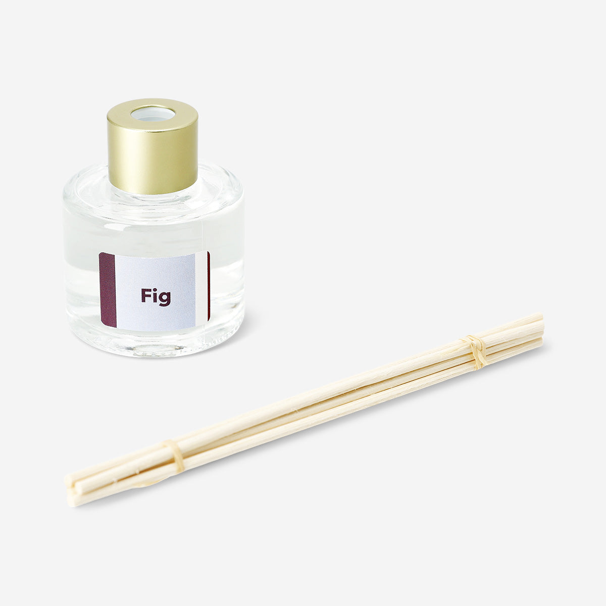 Flying Tiger Copenhagen fig-scented reed diffuser in a 50ml glass bottle, designed for home fragrance and decor.