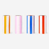 Four Flying Tiger Copenhagen lint roller refill packs with adhesive sheets for removing lint and pet hair from clothing.