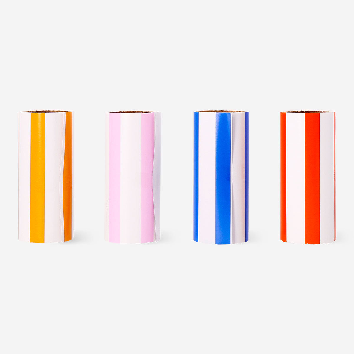 Four Flying Tiger Copenhagen lint roller refill packs with adhesive sheets for removing lint and pet hair from clothing.