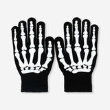 Glow in the dark skeleton gloves for adults, made of textile, featuring spooky skeleton design by Flying Tiger Copenhagen.