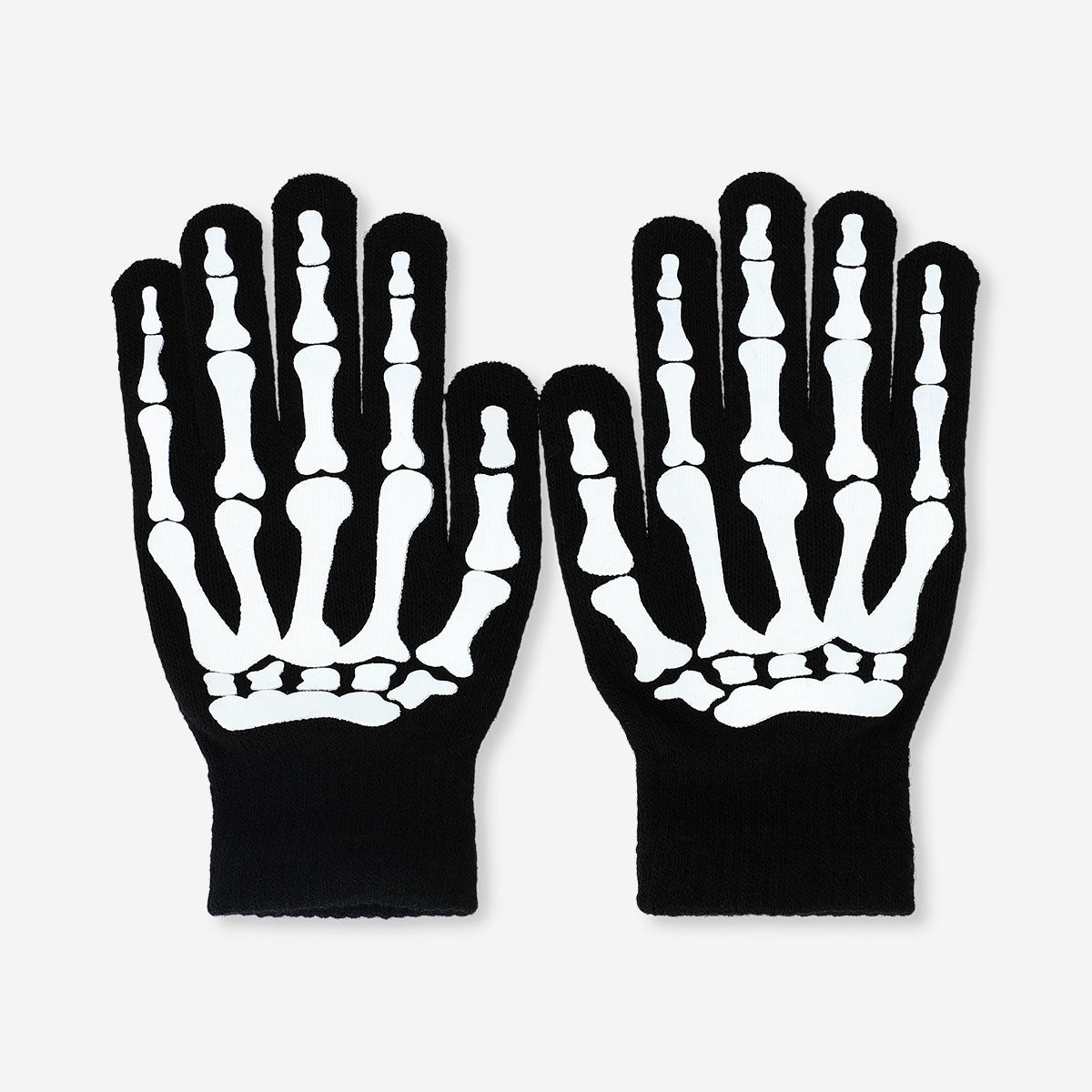 Glow in the dark skeleton gloves for adults, made of textile, featuring spooky skeleton design by Flying Tiger Copenhagen.