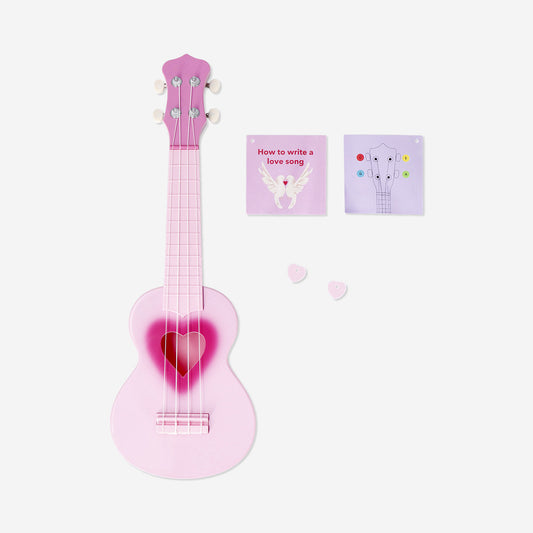 Pink ukulele with heart cut out