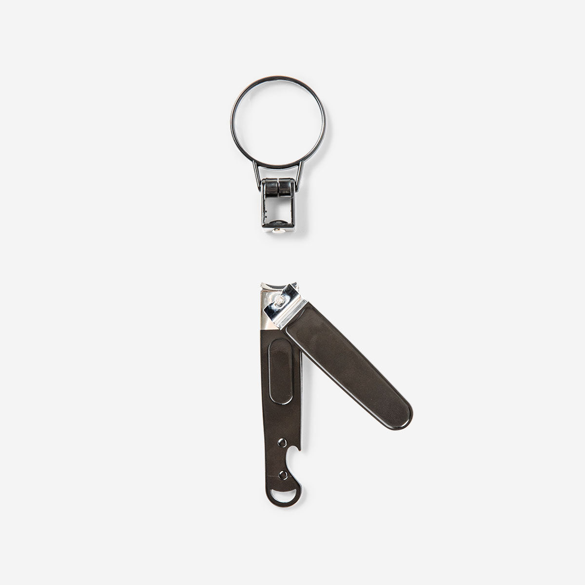 Flying Tiger Copenhagen nail clipper with bottle opener and magnifying glass, personal care tool for precise grooming.