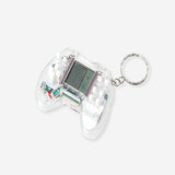 Flying Tiger Copenhagen keyring gadget featuring a game machine with multiple game icons in bright, playful colors.