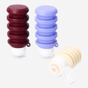 Set of three foldable silicone travel bottles by Flying Tiger Copenhagen, compact and reusable for leisure travel.