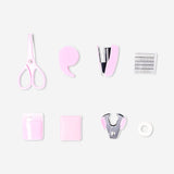 Pink Flying Tiger Copenhagen stationery kit with pens, notebooks, and office supplies arranged on a desk.