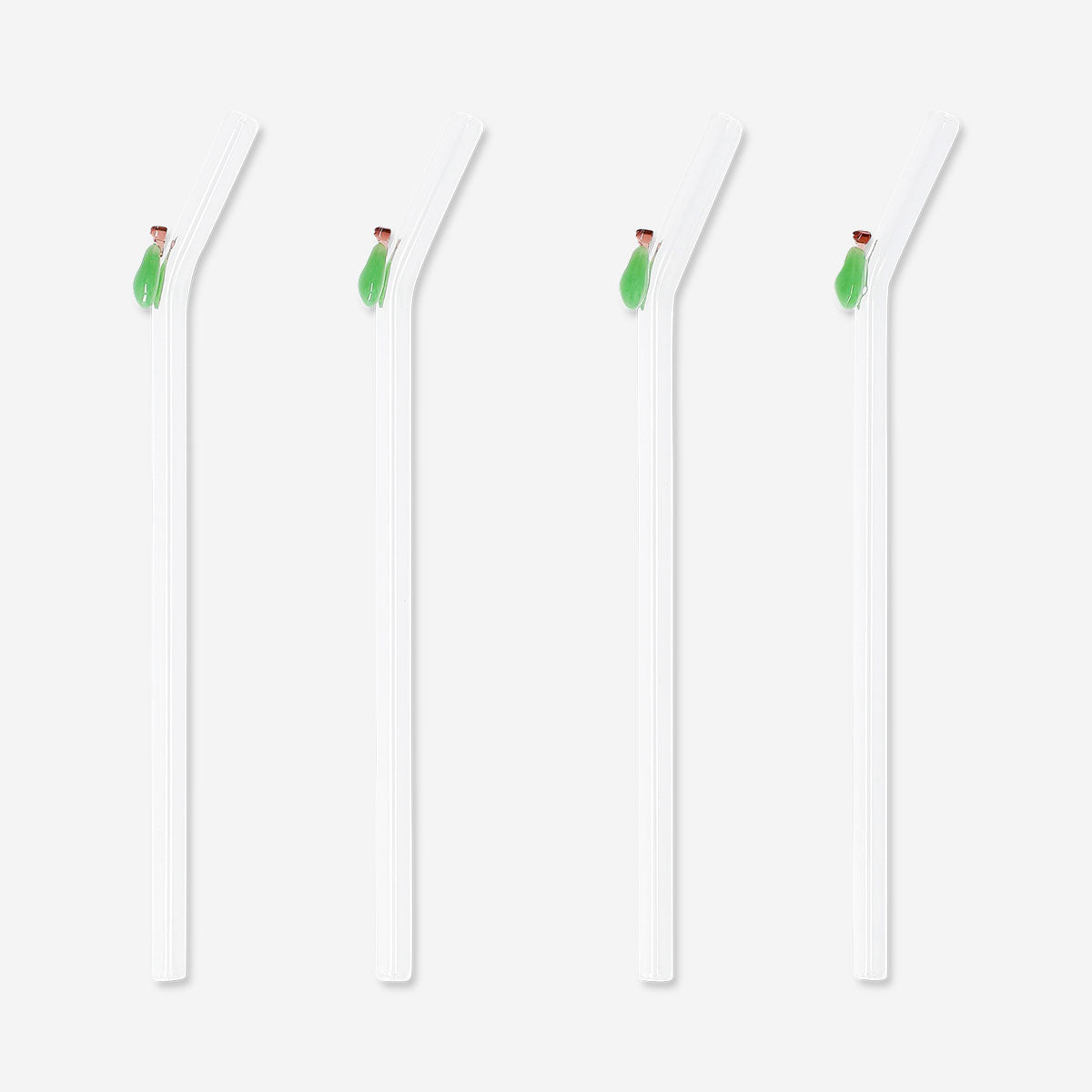 Set of four green glass straws with pear-shaped decorations, suitable for kitchen use, by Flying Tiger Copenhagen.