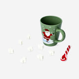 Mug with hot chocolate and candy cane spoon