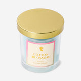 Flying Tiger Copenhagen scented candle with cotton blossom fragrance, showcasing a white candle in a clear glass holder.