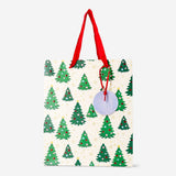 Office gift bag with embossed Christmas trees, Flying Tiger Copenhagen holiday-themed paper bag for wrapping presents during Christmas.